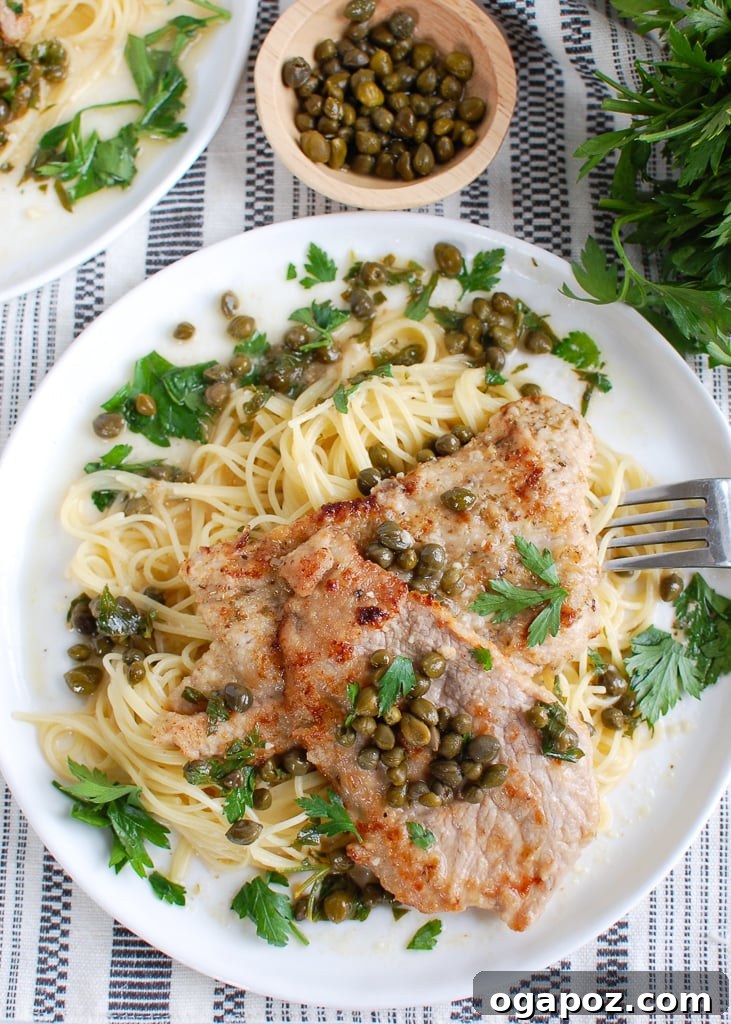 Zesty Lemon Caper Veal 4 Plated Veal Piccata, ready to be served