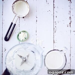 Whip Up Your Own Coconut Milk 6 Easy Homemade coconut milk served in a clear glass.