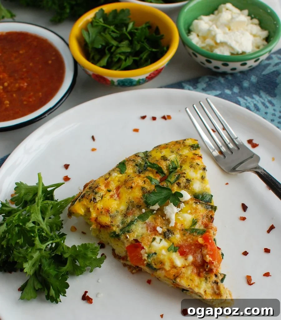Mediterranean Frittata garnished with fresh parsley on a white skillet