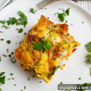 Sausage Egg Casserole garnished with fresh green onion, ready to serve