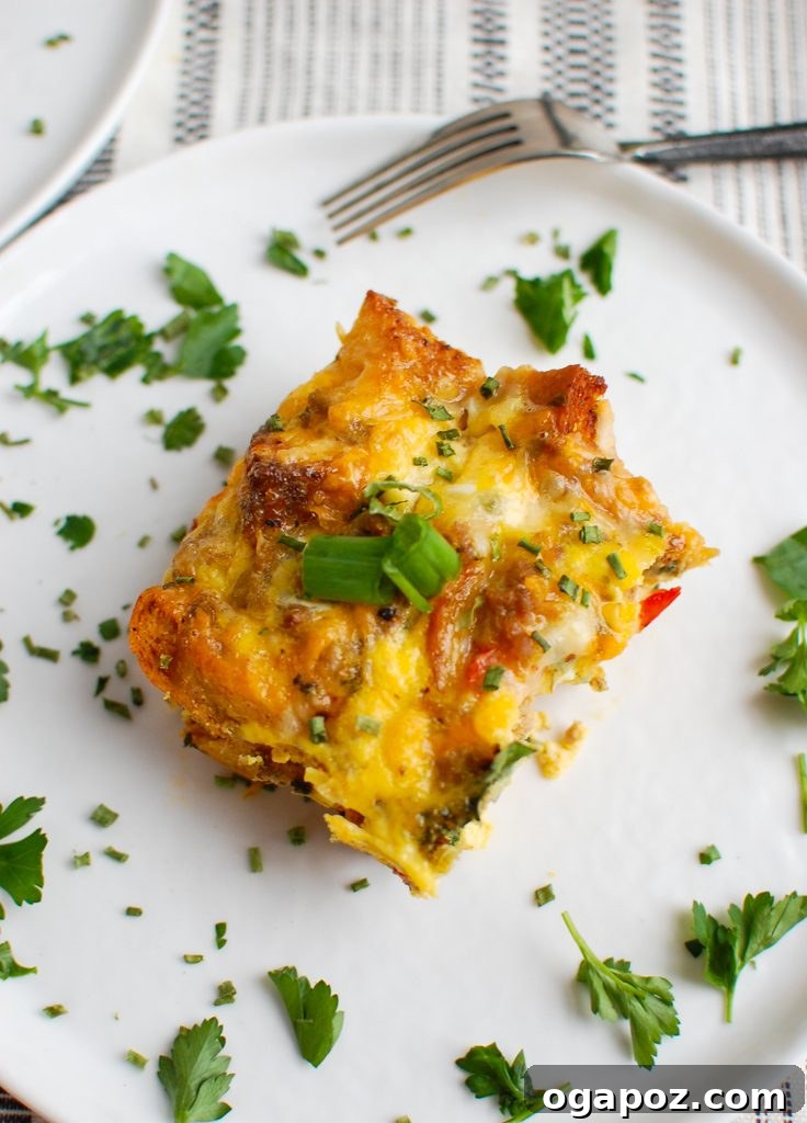 Rise & Shine Sausage Egg Bake 3 Close-up of Egg Sausage Casserole garnished with fresh green onion, ready to serve