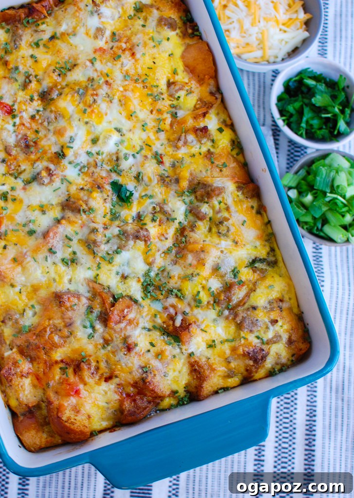 Rise & Shine Sausage Egg Bake 4 Egg Sausage Casserole baking in a teal ceramic dish, golden brown and bubbly