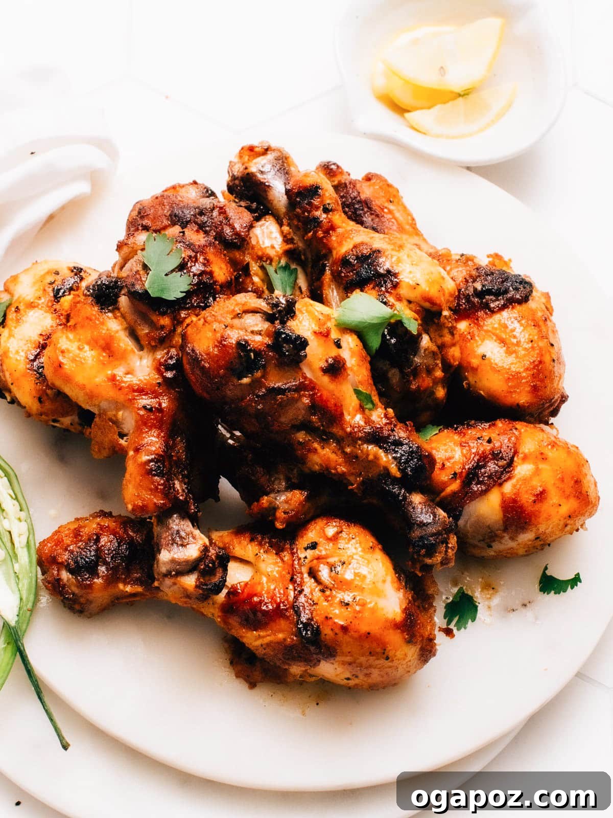 Incredible Indian Dinners Surprisingly Simple to Make 16 Tandoori chicken drumsticks on a plate, a classic Indian dinner.
