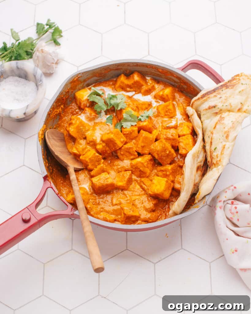 Incredible Indian Dinners Surprisingly Simple to Make 6 Butter paneer in a pan with naan, a comforting vegetarian Indian dinner.