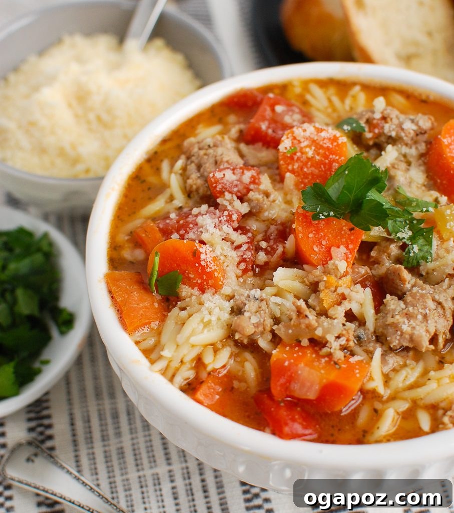 Hearty Italian Sausage Soup 2 Italian Sausage Soup in white bowl with fresh parsley garnish