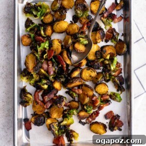 Irresistible Maple Bacon Brussels Sprouts 9 Crispy Roasted Brussels Sprouts with Maple and Bacon on a baking sheet with parchment paper.