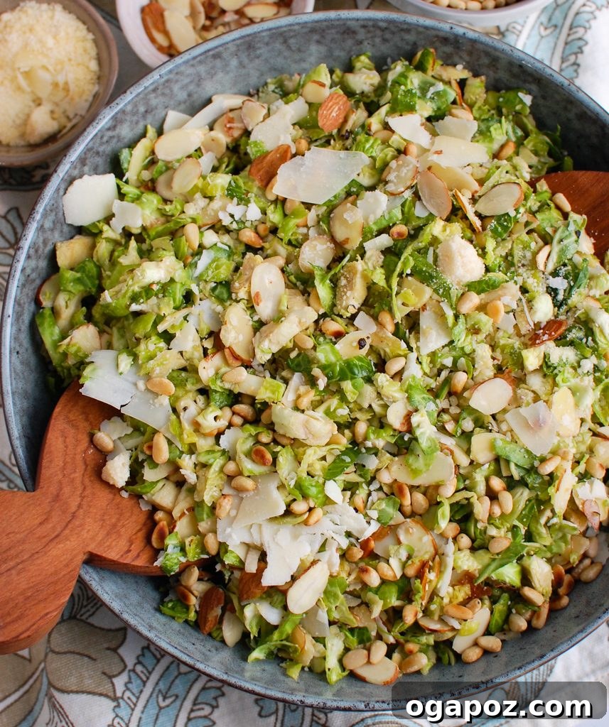 Brussels Sprout Ribbon Salad 5 Shaved Brussels Sprouts Salad featuring pine nuts, captured from a delicious angle.