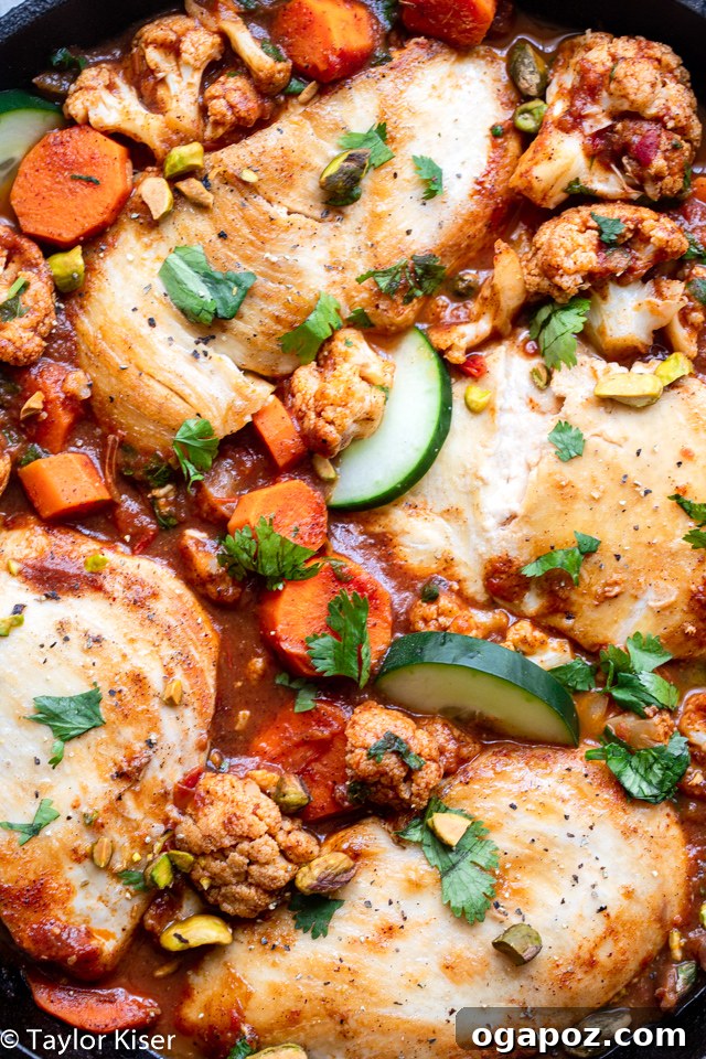 A sizzling Moroccan Chicken Skillet, a quick and easy one-pan, gluten-free, paleo-friendly weeknight dinner with vibrant vegetables.