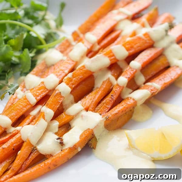 A vibrant plate of Moroccan Spiced Roasted Carrots with Creamy Yogurt Dressing, a flavorful and colorful side dish.