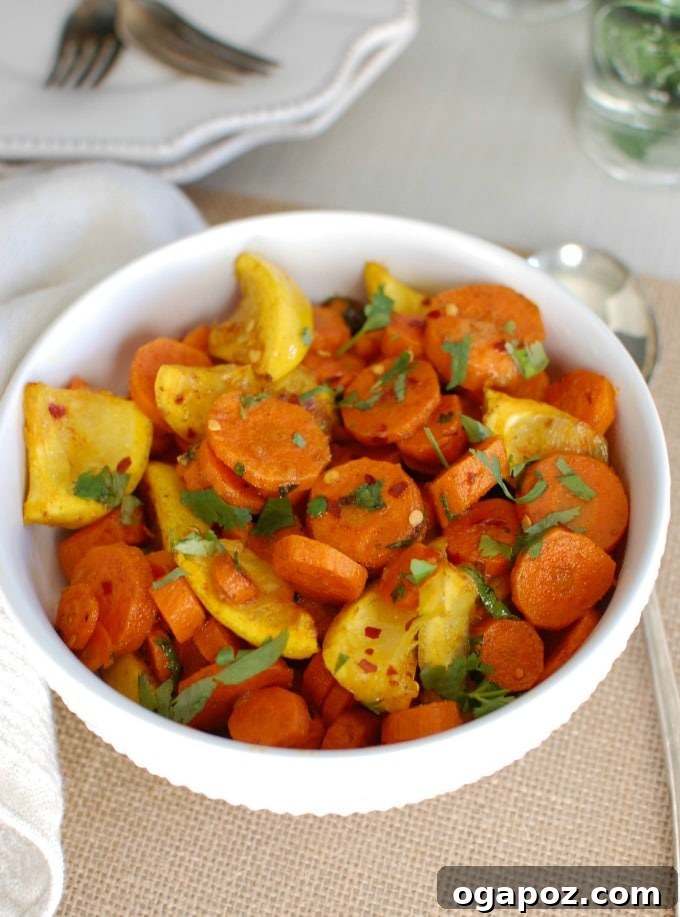 Close-up of Moroccan Roasted Carrots, a simple yet flavorful side dish with warm spices, lemon, and fresh cilantro, served in a bowl.