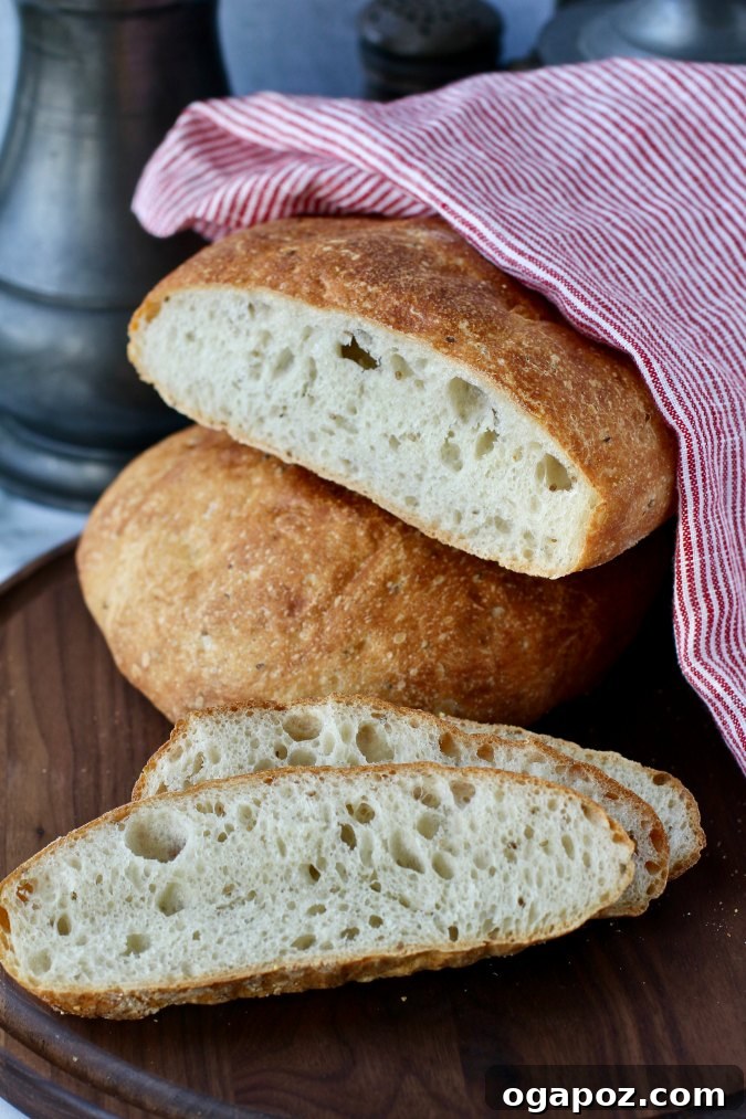 Stacked No Knead Ksra, a Moroccan flatbread subtly flavored with anise and barley, perfect for scooping up tagines.
