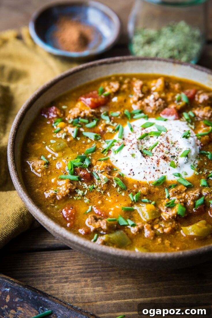 10 Ultimate Instant Pot Chili Recipes 12 A rustic bowl of Instant Pot Paleo Pumpkin Chili, rich in color and texture.