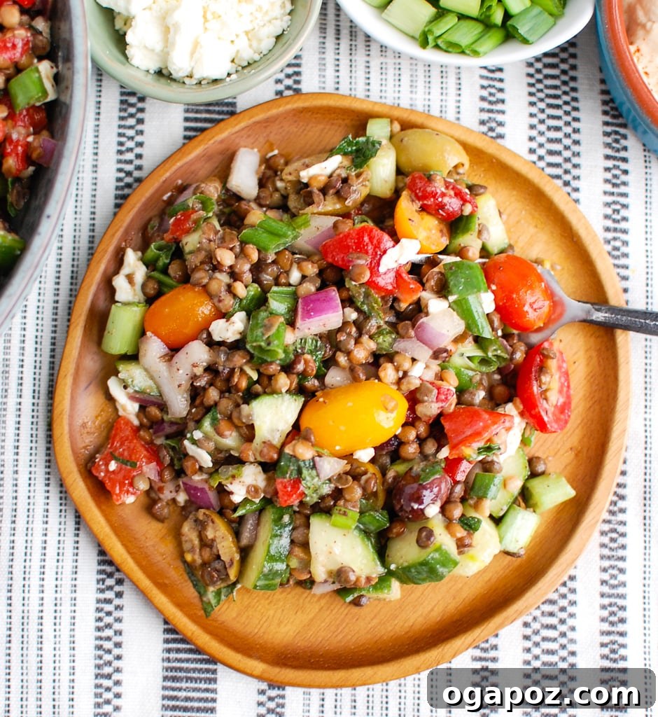Vibrant Mediterranean Lentil Salad 4 Mediterranean Lentil Salad on a wooden plate with a fork