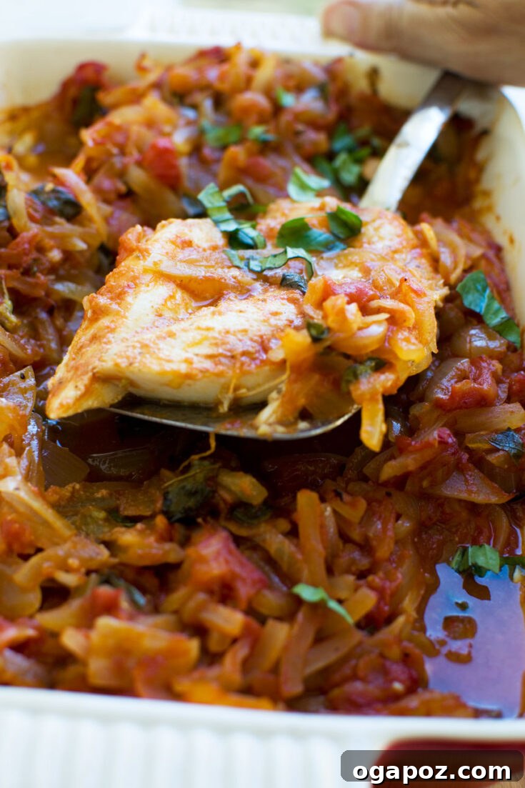 Greek Baked Fish, served with lemon wedges and fresh herbs.