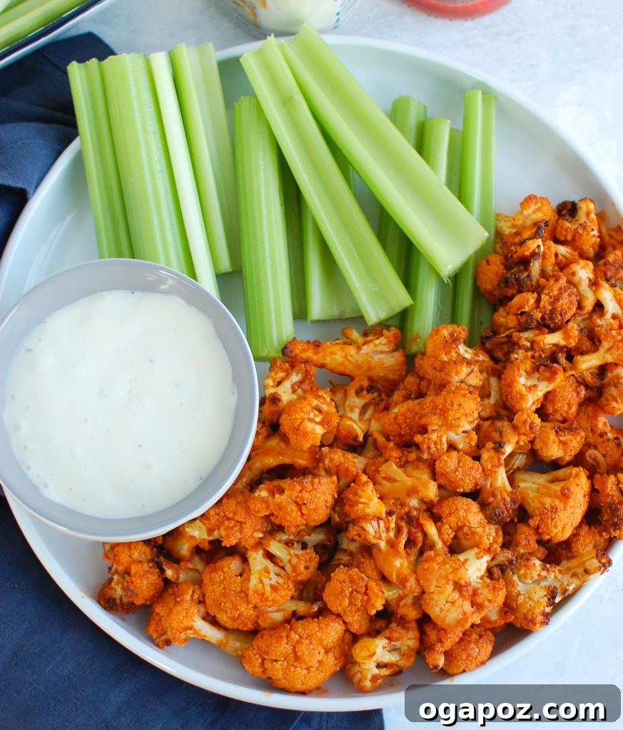 Air-Fried Spicy Cauliflower Wings 4 Air Fryer Buffalo Cauliflower served fresh from the air fryer, garnished