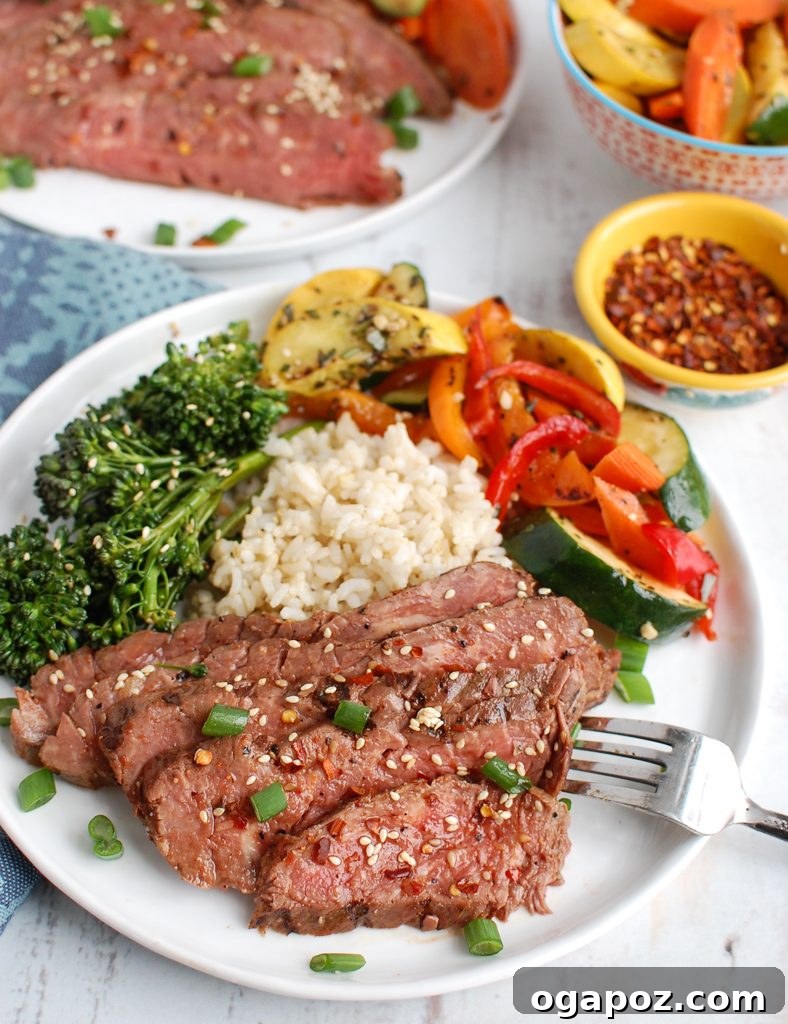 Sweet and Savory Asian Flank Steak 3 Plated Asian Marinated Flank Steak served with a side of rice