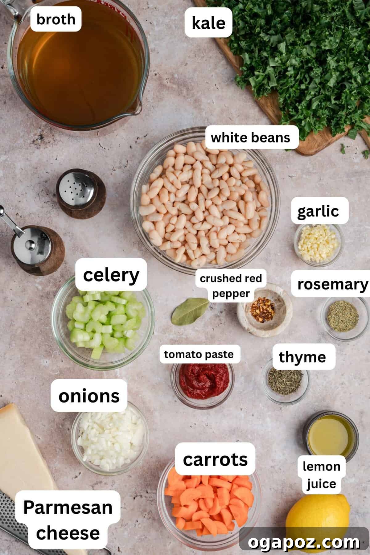 A selection of fresh recipe ingredients for homemade Tuscan white bean soup, including cans of cannellini beans, vibrant kale, diced carrots, celery, and aromatic herbs, arranged in a rustic setting, ready for preparation.