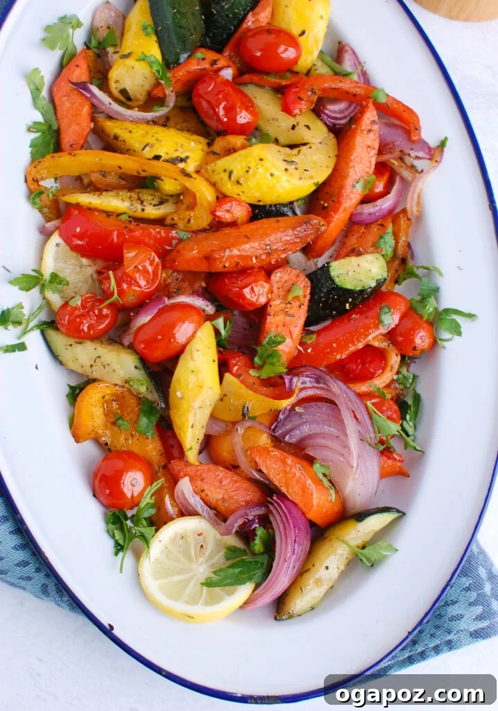 Sun-Kissed Mediterranean Medley 4 A vibrant serving of Mediterranean Roasted Vegetables on a white and blue plate, beautifully arranged and ready to be enjoyed, showing off the perfectly cooked and seasoned vegetables.