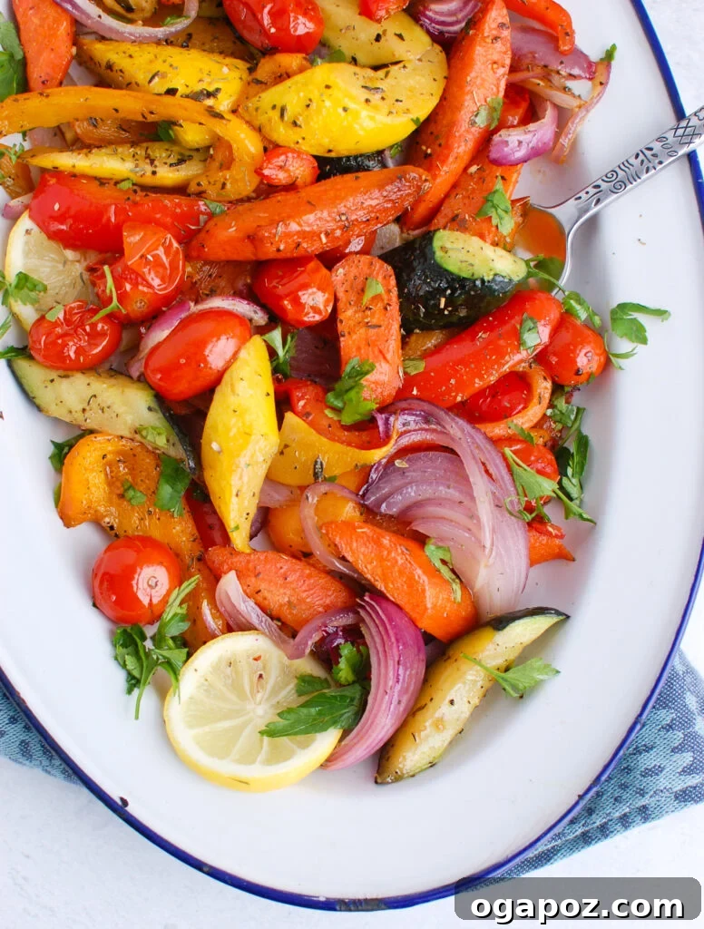 Sun-Kissed Mediterranean Medley 5 Close-up of Mediterranean Roasted Vegetables garnished with fresh lemon slices, highlighting their vibrant colors, tender texture, and a zesty finish ready for serving.