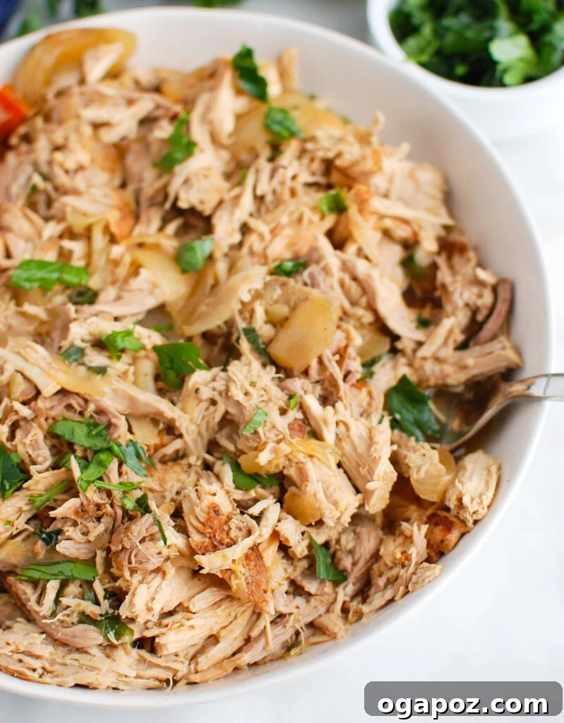 Slow Cooker Pork Shoulder Perfection 3 Slow Cooker Pork Roast shredded in a bowl, ready to serve