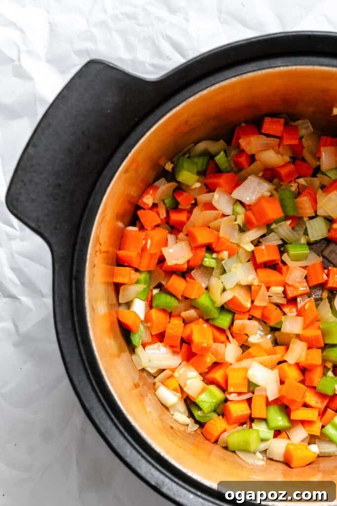 The Ultimate Homemade Vegetarian Chili 6 Carrots and celery sauteing with onions in a pot for chili