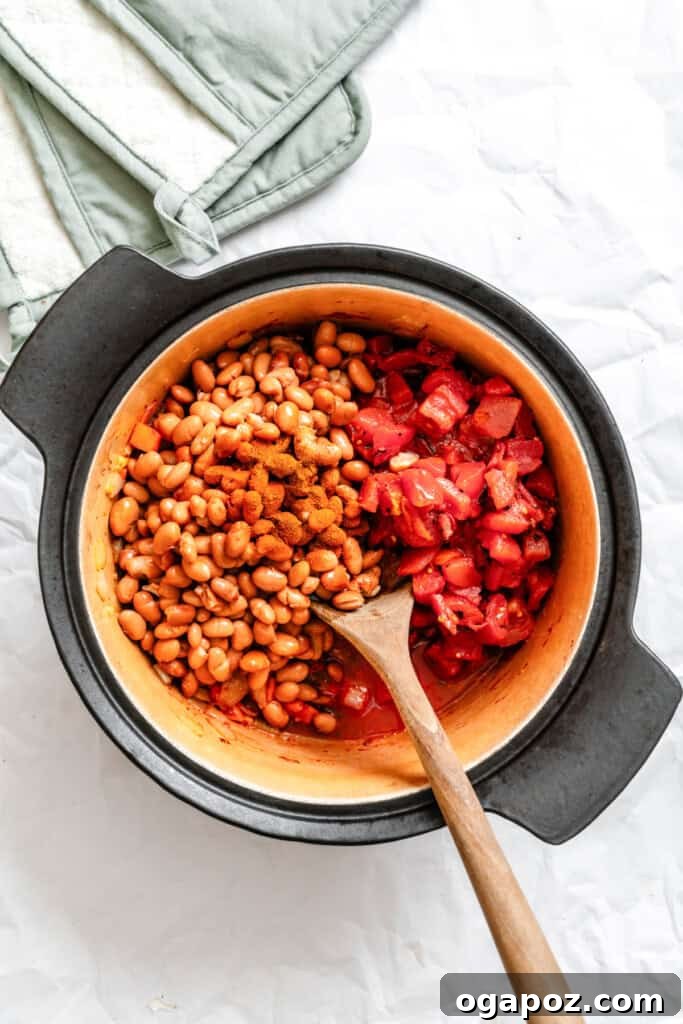 The Ultimate Homemade Vegetarian Chili 7 Stirring all chili ingredients together in a large pot