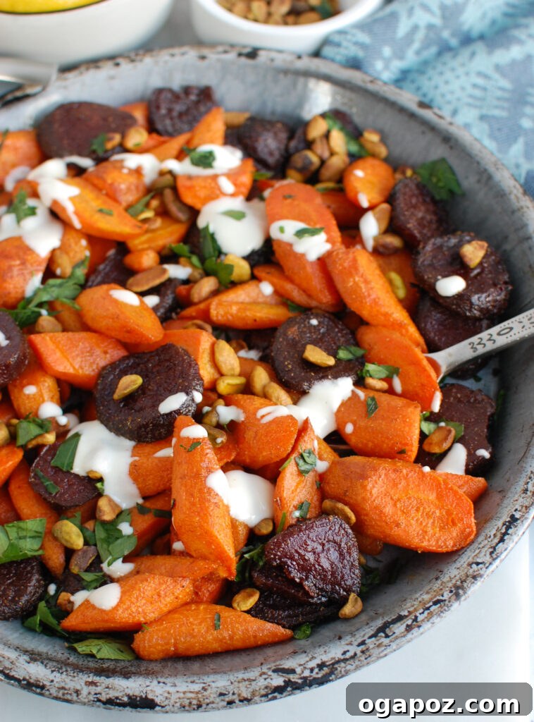 Mediterranean Roasted Roots with Tahini Drizzle 4 Roasted Carrots and Beets with Tahini served on a platter, topped with crunchy pistachios and fresh parsley.