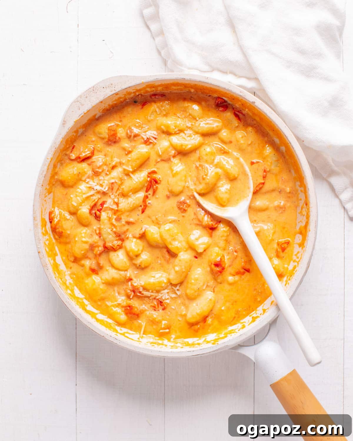 Irresistible Gnocchi Sauce Quick and Easy 11 Creamy Tomato Gnocchi Sauce in Pan with Spoon, ready to serve