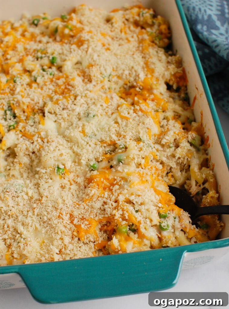 Quick and Creamy Tuna Noodle Bake 4 Easy Tuna Noodle Casserole with serving spoon