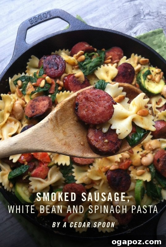 Smoked Sausage Pasta with White Beans, Spinach, and Toasted Pine Nuts