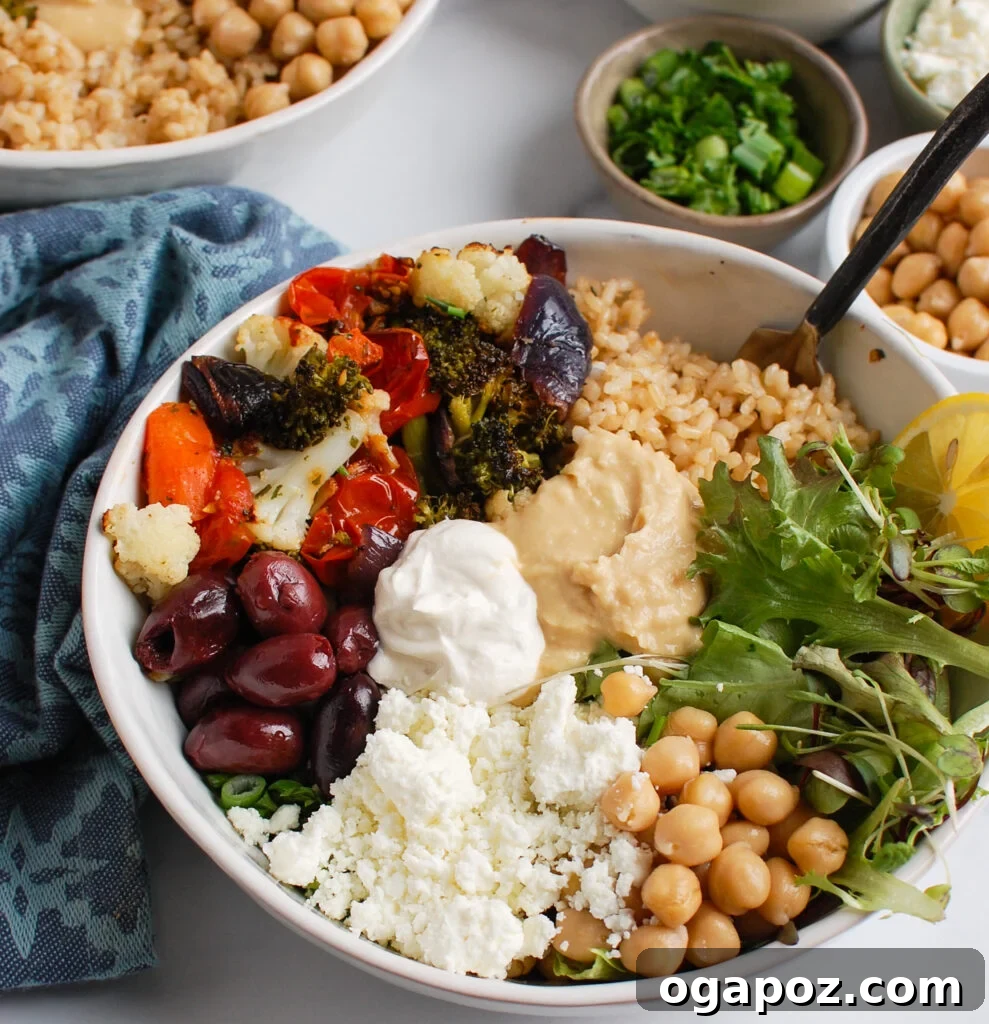 Mediterranean Mezze Bowl 5 Mediterranean Buddha Bowl garnished with feta cheese and herbs