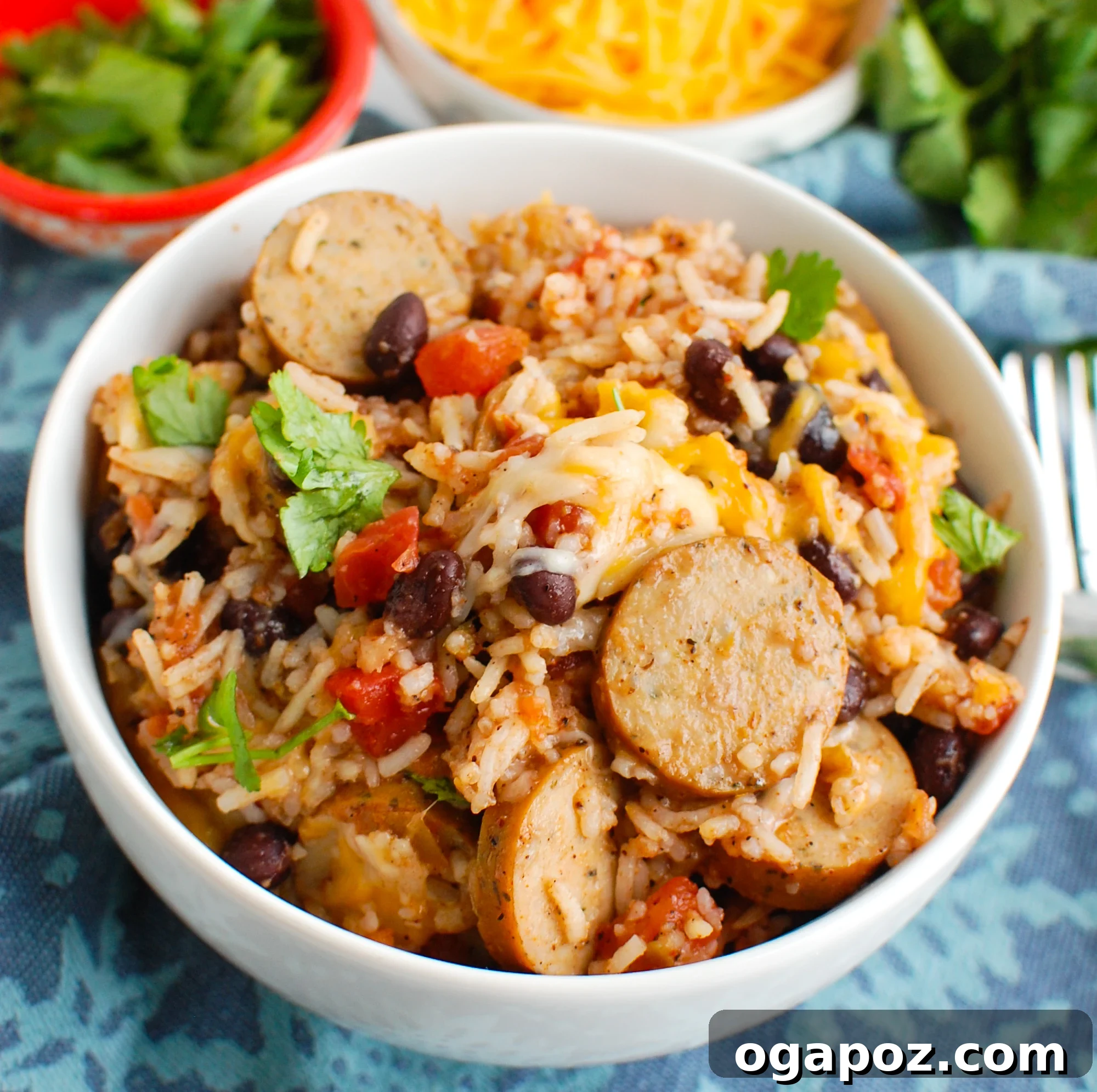 A serving of comforting Sausage and Bean Casserole in a white bowl, ready to enjoy.