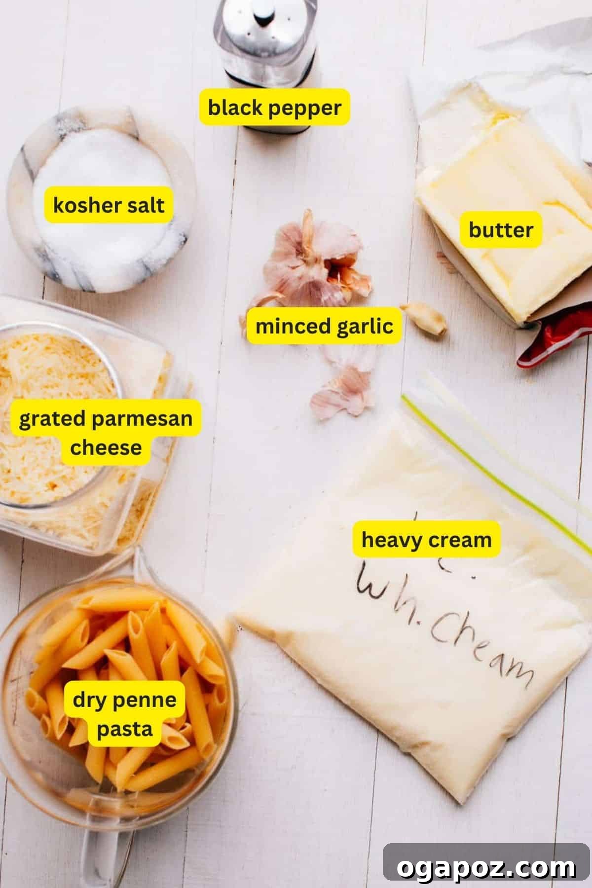 Easy Penne Alfredo: Your New Go-To Weeknight Meal 3 A curated selection of fresh ingredients including garlic, butter, heavy cream, Parmesan, and penne pasta.