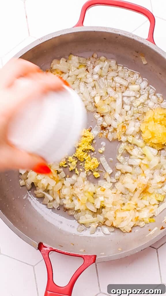 Creamy Butter Paneer 8 Sautéing finely chopped onions, garlic, and ginger in a Dutch oven for the Butter Paneer gravy.