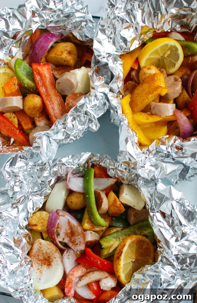 Effortless Sausage and Shrimp Foil Meals 7 Cooked Sausage and Shrimp Foil Packets, opened to reveal the delicious meal.