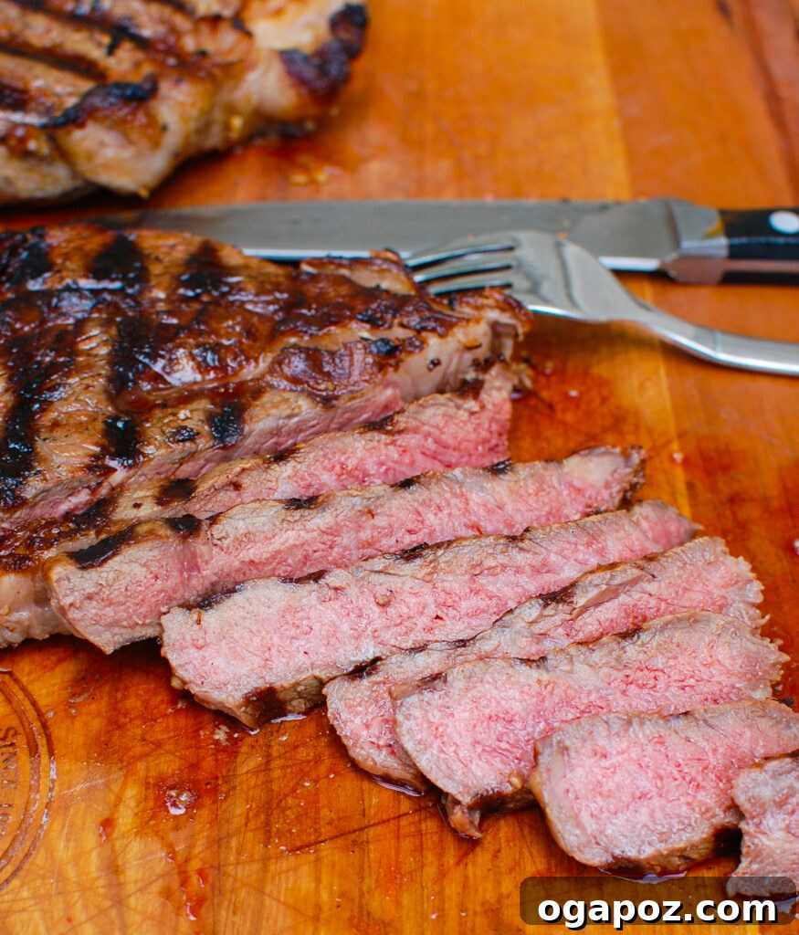 Grilled Ribeye with Lemon Garlic Butter 6 Sliced Lemon Garlic Butter Grilled Ribeye steak revealing its juicy interior