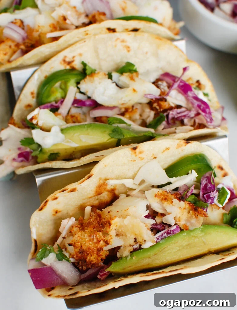 Effortless Cod Fish Tacos 5 Easy Cod Fish Tacos arranged in a silver serving tray
