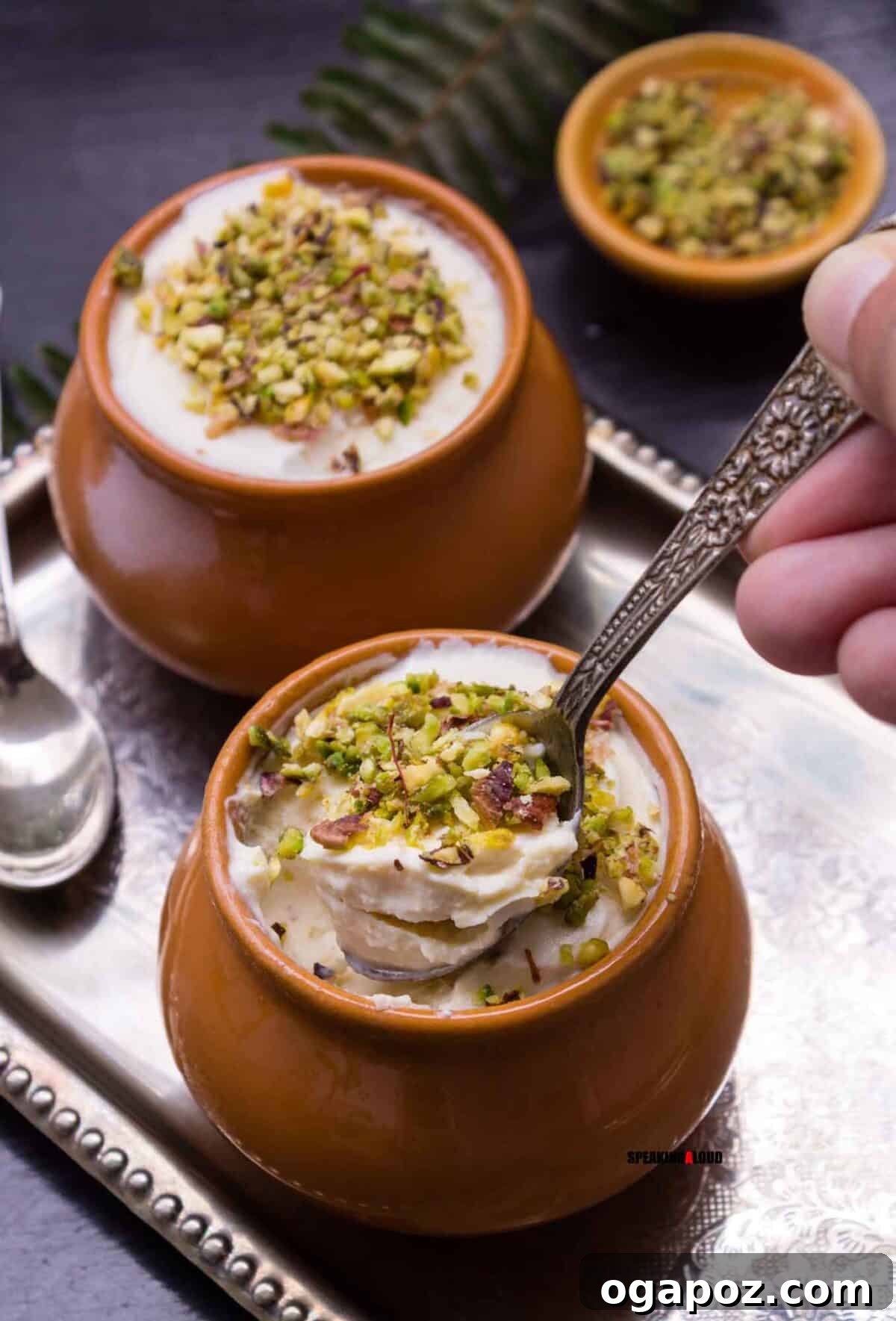 Easy Indian Desserts That Wow 21 Beautiful Kesar Badam Matka Kulfi, pistachio-saffron kulfi traditionally set and presented in charming small clay pots for an authentic touch.