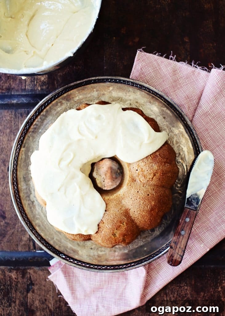 Easy Indian Desserts That Wow 7 A slice of cozy Chai Apple Cake with rich cream cheese frosting, infused with aromatic masala chai tea spices.