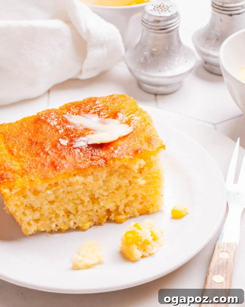 35+ Irresistible Side Dishes for Salmon 29 Cornbread casserole on a plate, showing its light and fluffy texture.