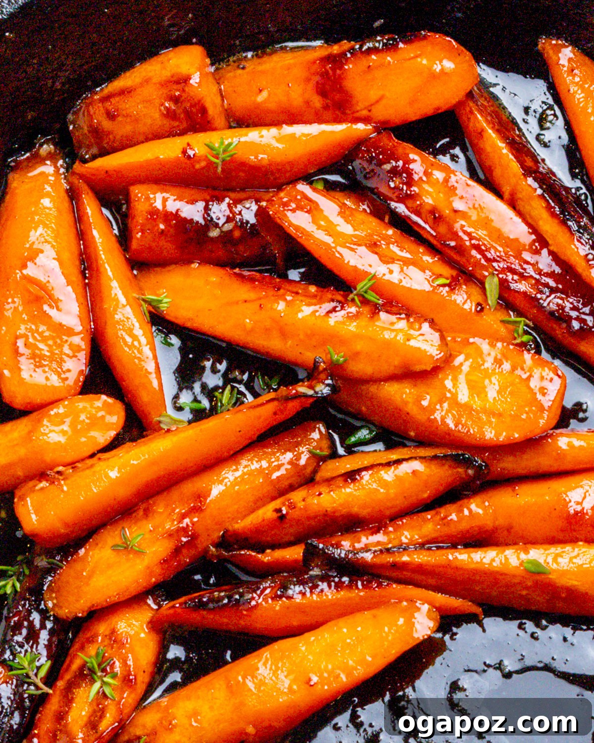 35+ Irresistible Side Dishes for Salmon 10 Glazed Carrots close-up photo in a pan, showing their sweet, glossy coating.