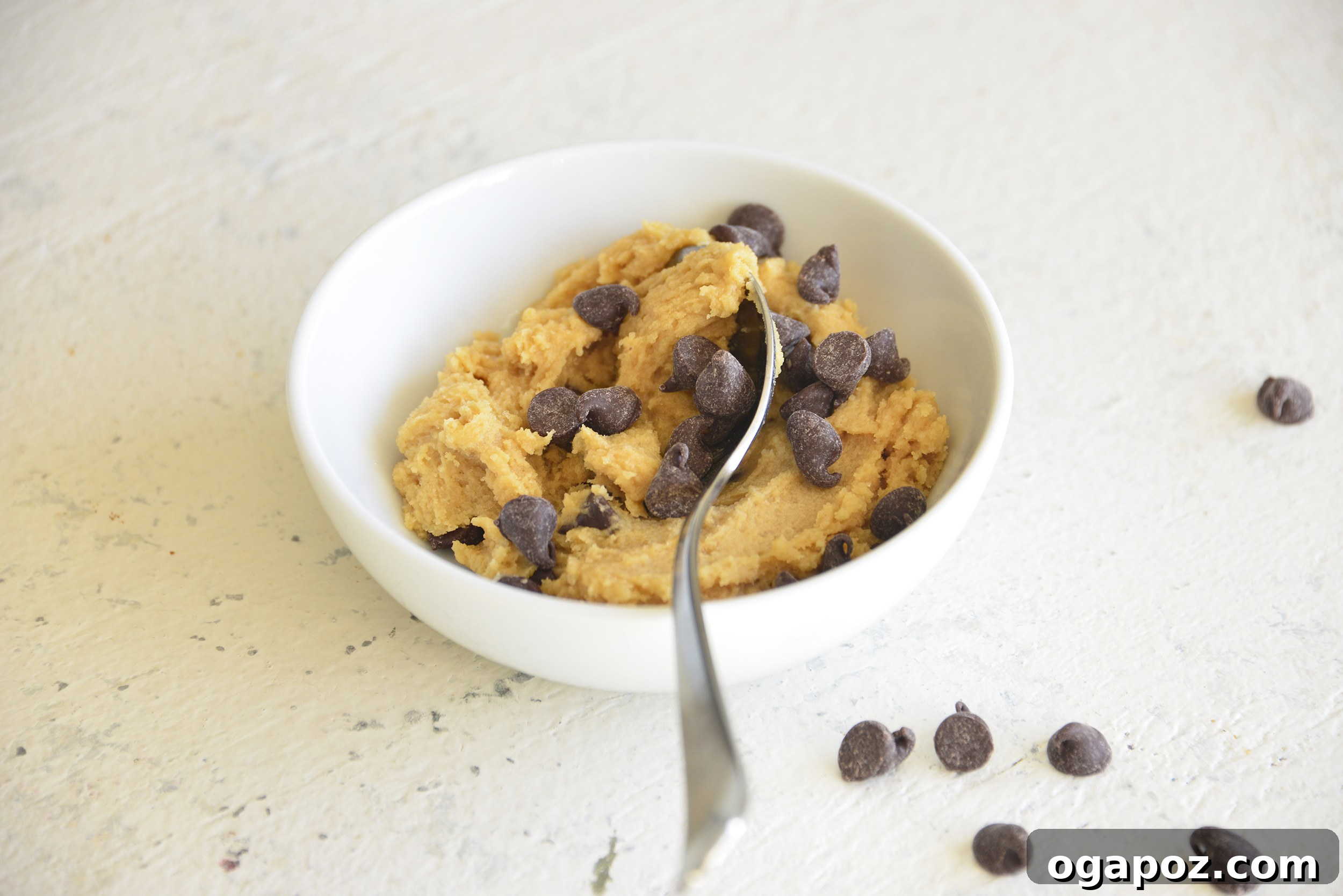 Solo Cookie Dough Indulgence 7 Edible Cookie Dough for One with a spoon, close-up shot.