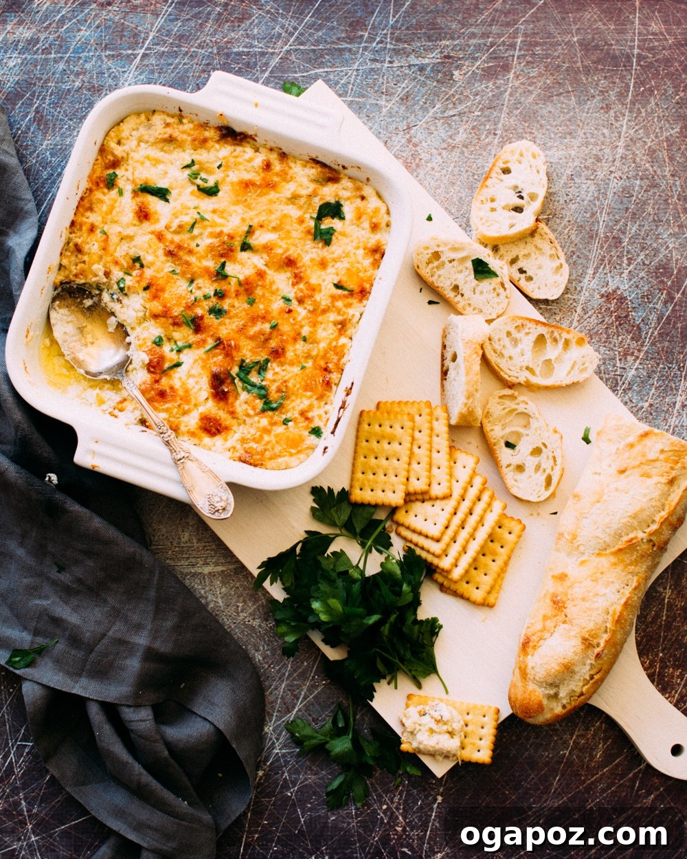Cheesy Baked Shrimp and Artichoke Dip 2 A parent pushing a double stroller with children bundled up, amidst a winter setting.