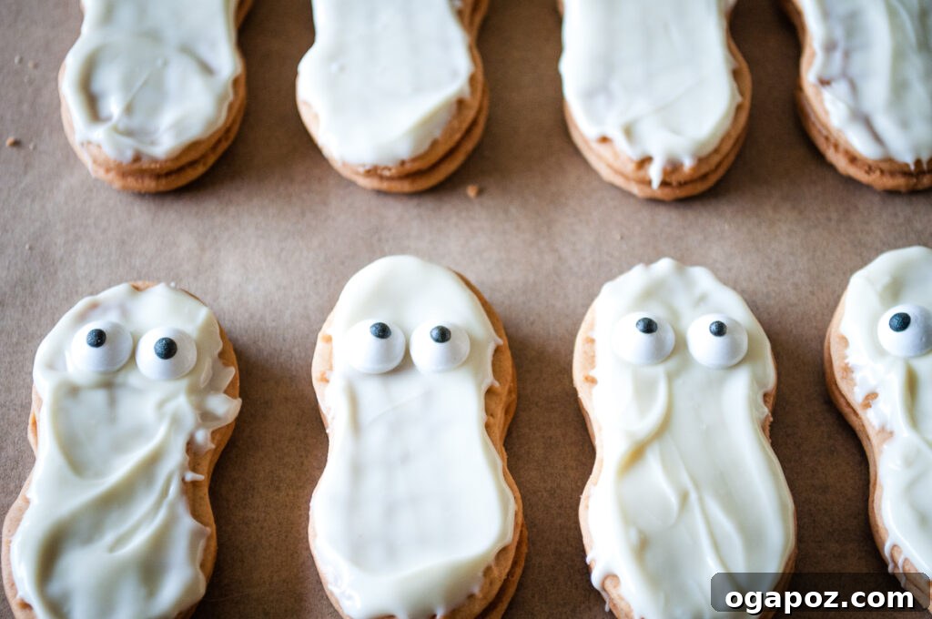 Spooky Mummy Cookies 6 Mummy Cookies with candy eyes set, awaiting their frosting bandages
