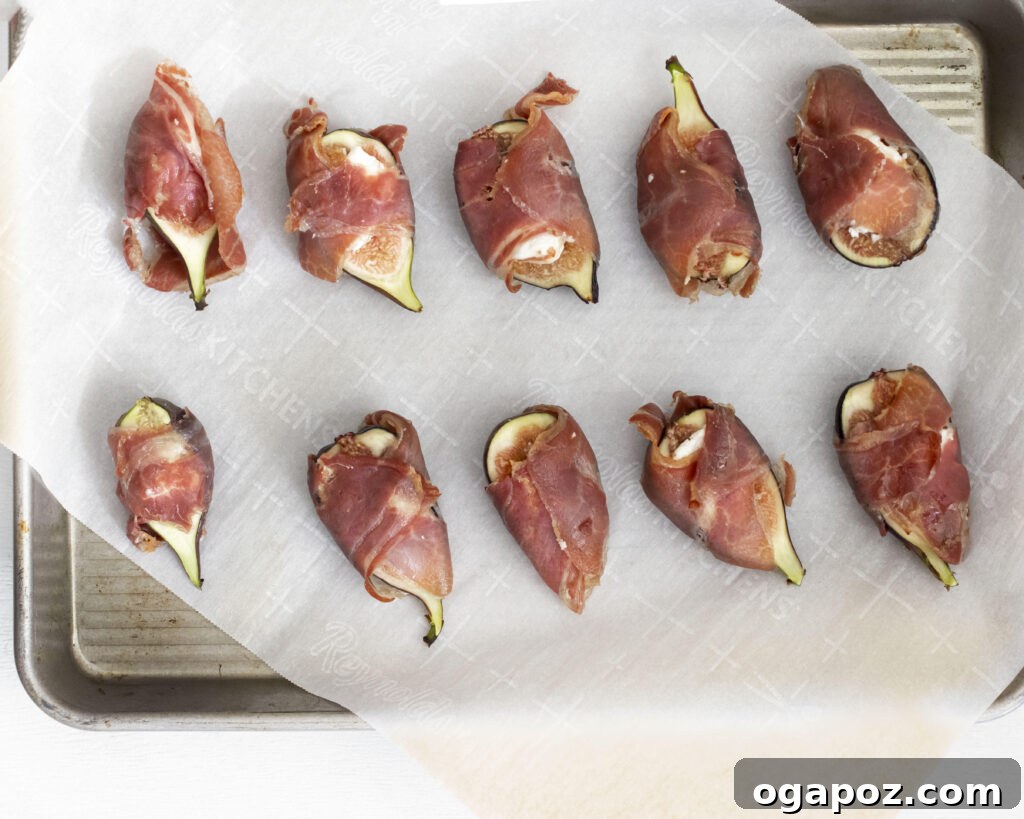 Fig & Goat Cheese Jewels Wrapped in Prosciutto 5 Goat Cheese Figs Wrapped in Prosciutto being assembled, with goat cheese placed on fig halves and prosciutto ready to wrap