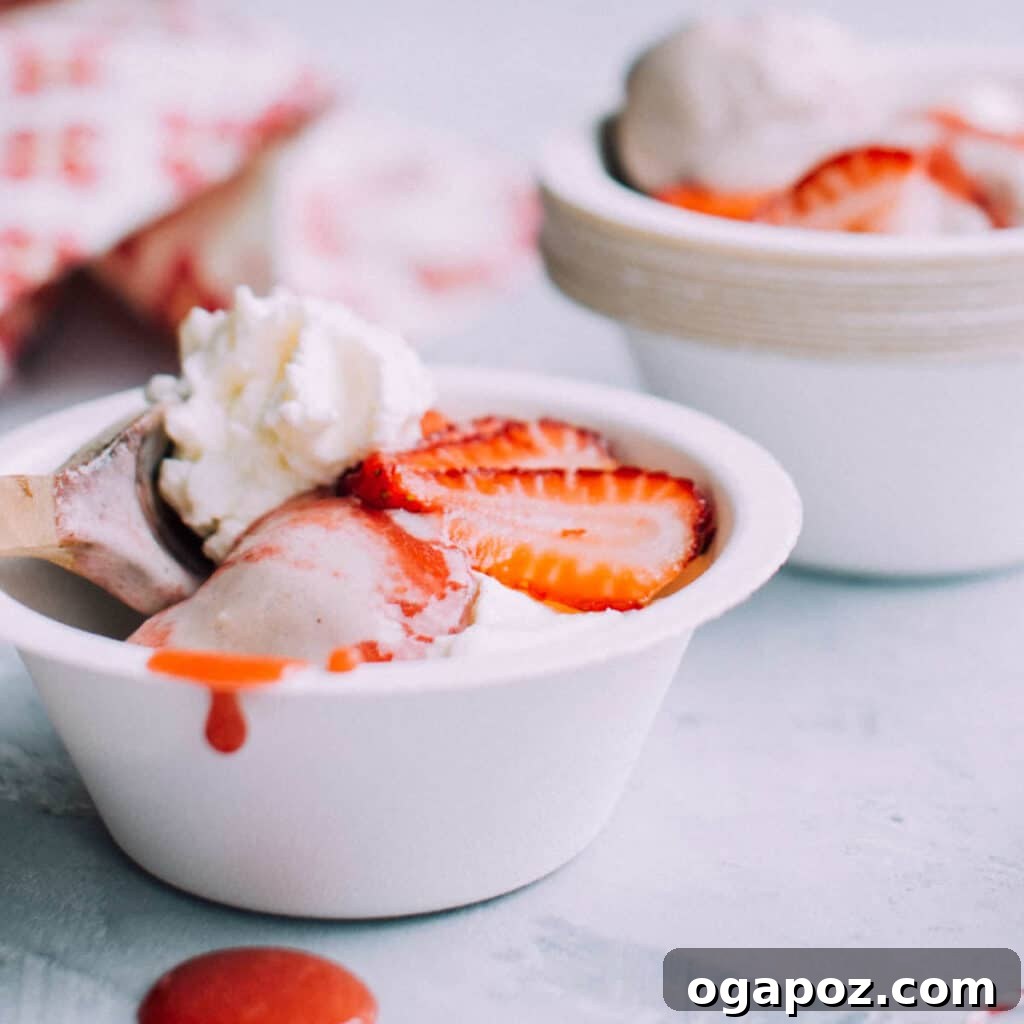 Simple 3-Ingredient Banana Nice Cream 2 A bowl of creamy banana ice cream topped with fresh strawberries, ready to be enjoyed.