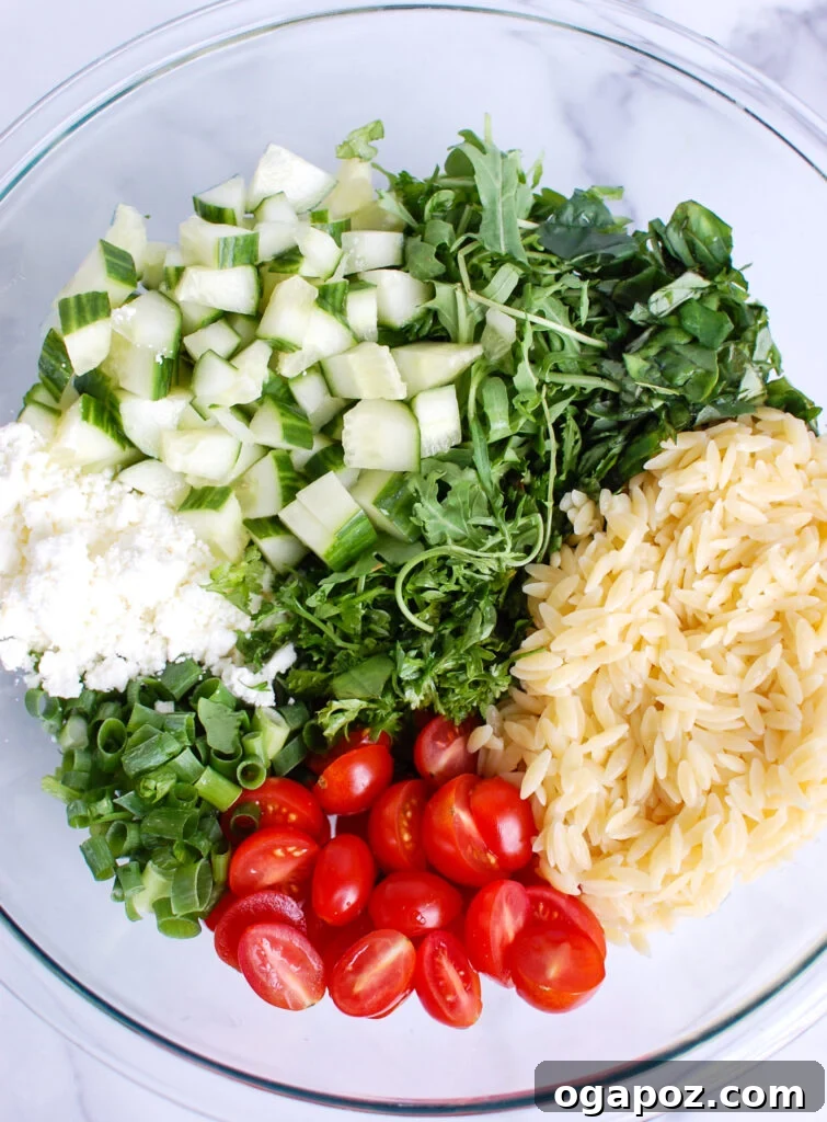 Vibrant Tomato Feta Orzo Salad 5 All the fresh ingredients for Tomato Feta Orzo Salad laid out, ready for preparation.