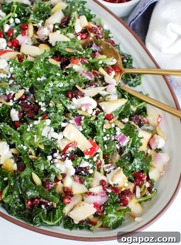 Crisp Autumn Harvest Salad 2 Easy Fall Salad in white dish, garnished with fresh fruits and cheese