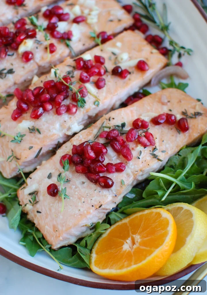 Jeweled Pomegranate Salmon 2 Honey Glazed Pomegranate Salmon with fresh arugula on a white plate