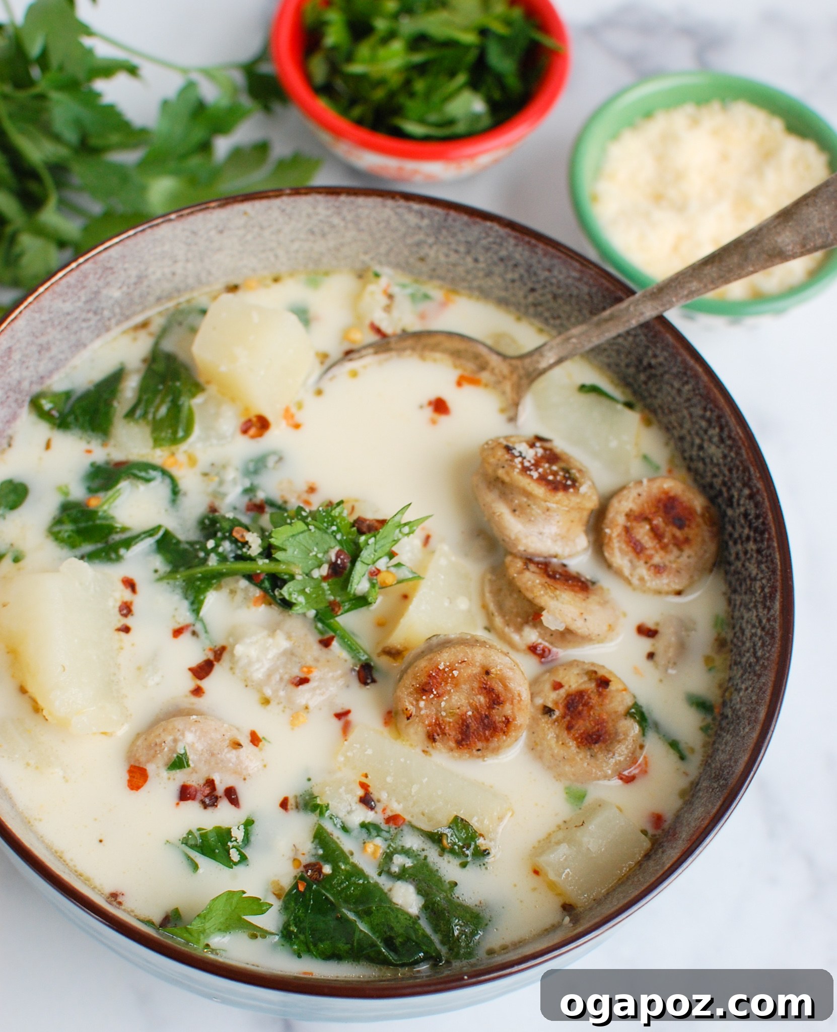Effortless Slow Cooker Zuppa Toscana 5 Slow Cooker Zuppa Toscana showing tender potatoes in the creamy broth.